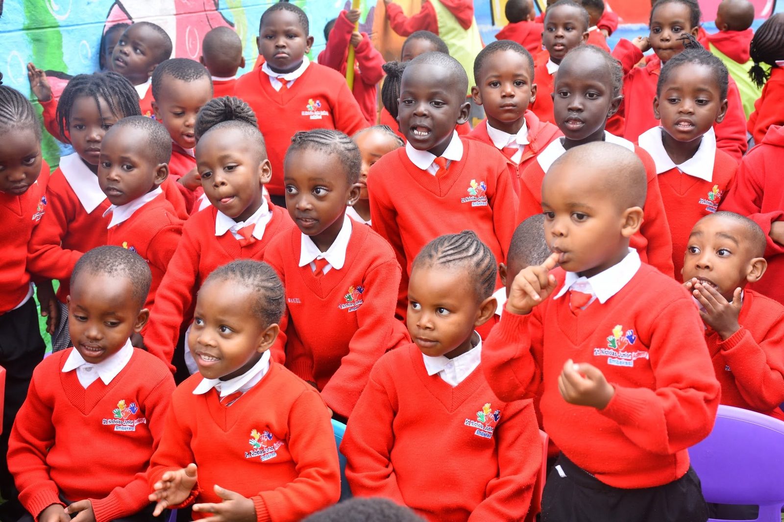 St. Nicholas pupils in class in red uniform